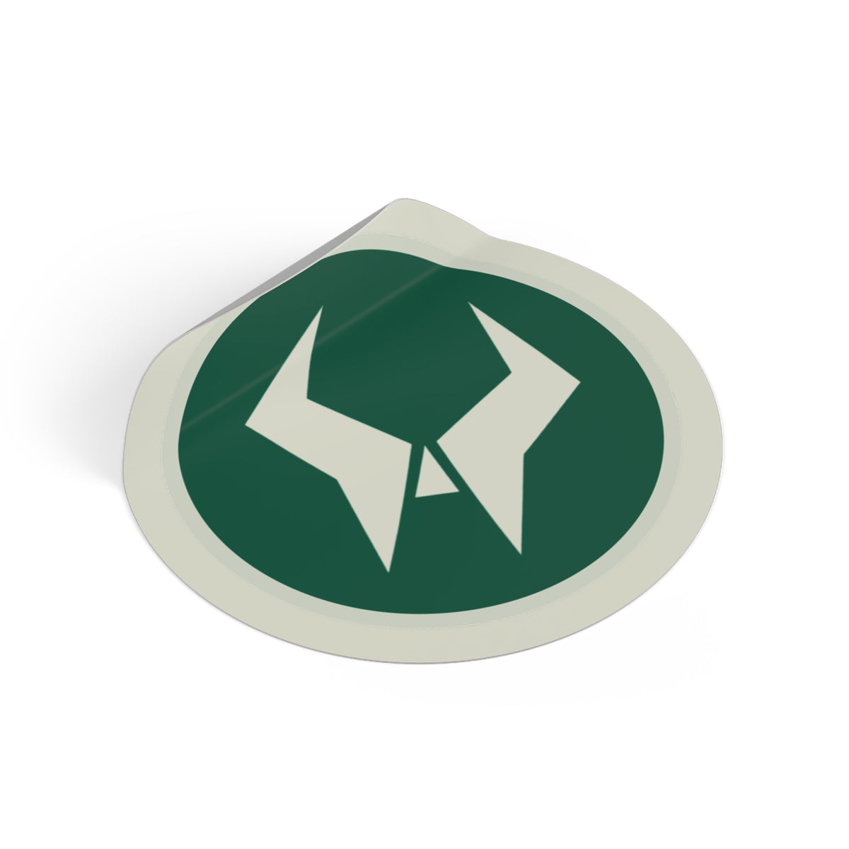 Oddsaint emblem sticker with its corner peeled up