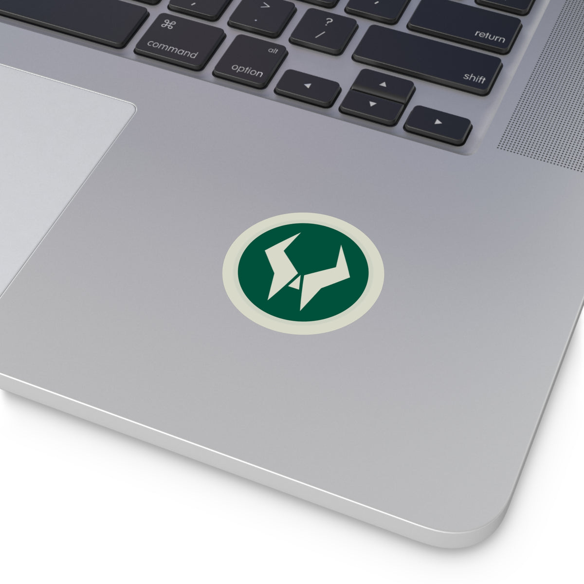 Oddsaint emblem sticker on a laptop
